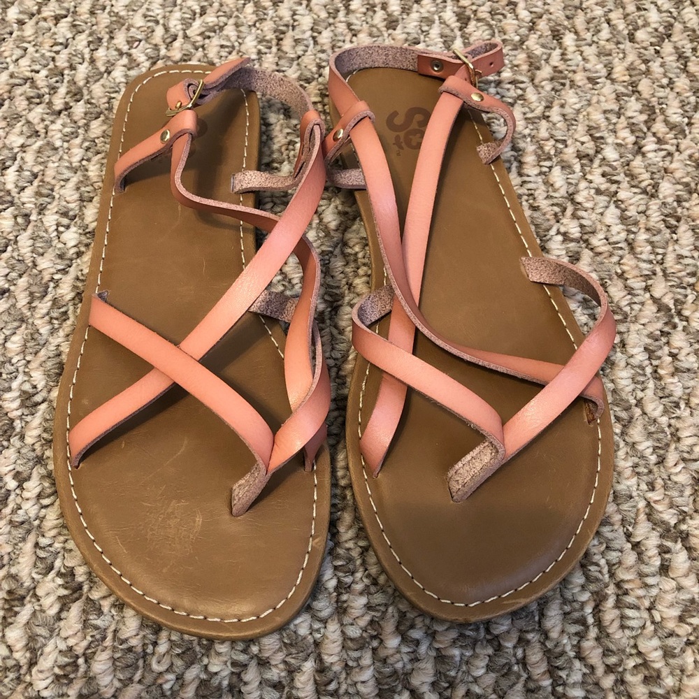 Salmon colored flat cross strap sandal
